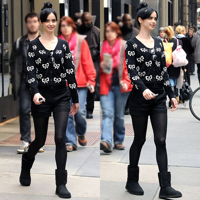 All-black makes Krysten Ritter's twee ribbon-print cardigan and flat-front shorts a little bit edgier