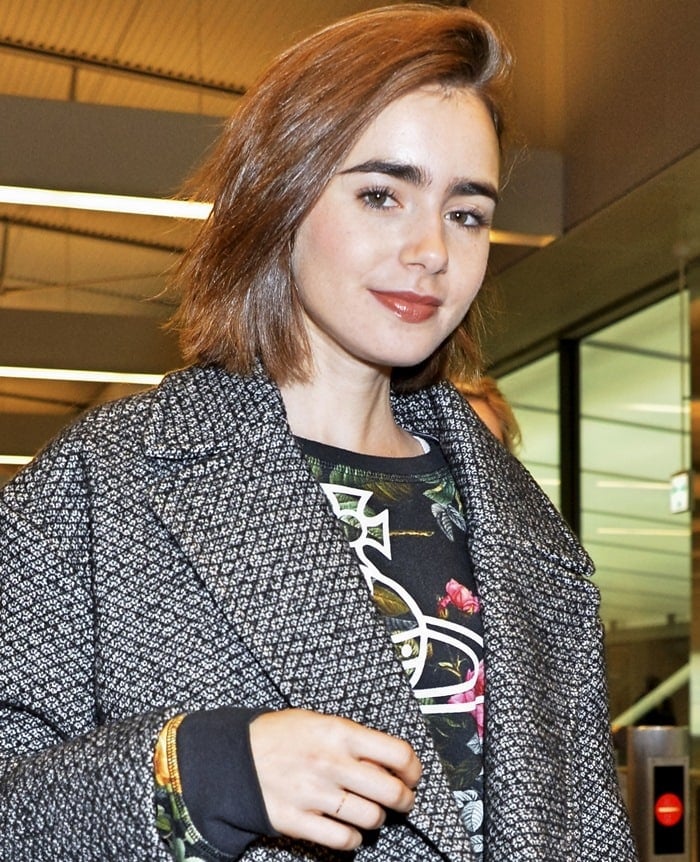 Lily Collins arriving at Narita International Airport in Chiba, Japan, on December 1, 2014