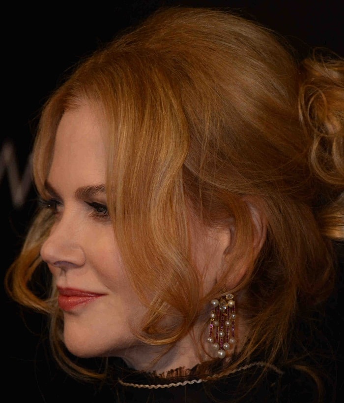 Nicole Kidman shows off her statement earrings and soft curls at the Agon Channel launch party in Milan