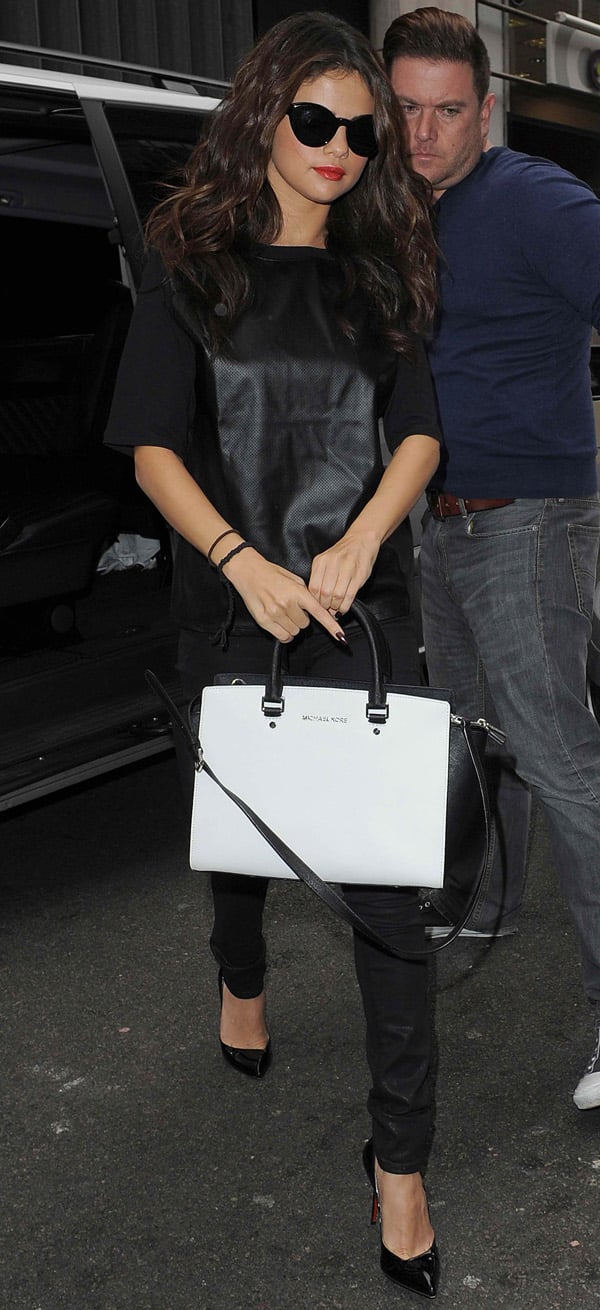 Selena Gomez toted a white Michael Kors bag