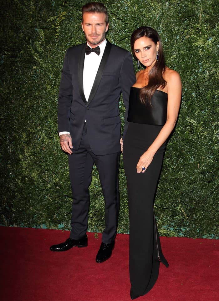 Victoria Beckham wore a strapless black gown from her own line, which had an exposed zipper at the back, while David Beckham sported a navy tuxedo with a black shawl collar paired with a bow tie
