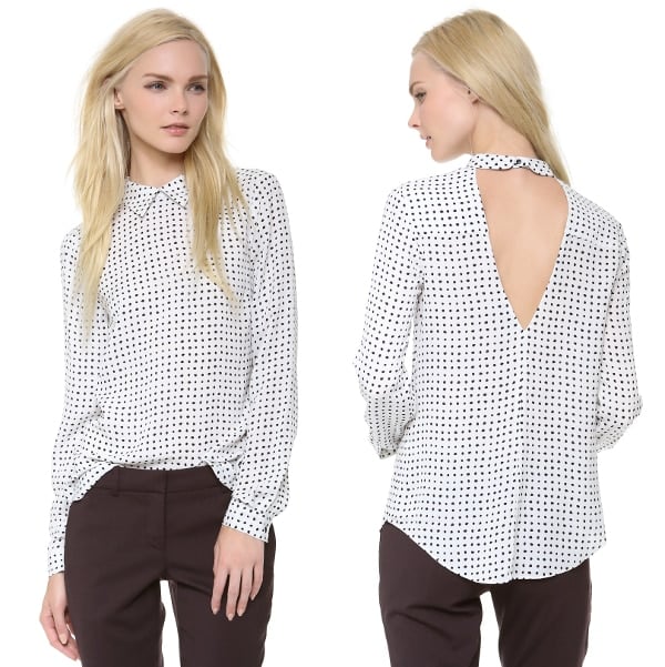 A polka-dot silk A.L.C. blouse blends allure with preppy chic, pairing a crisp fold-over collar with a deep V back