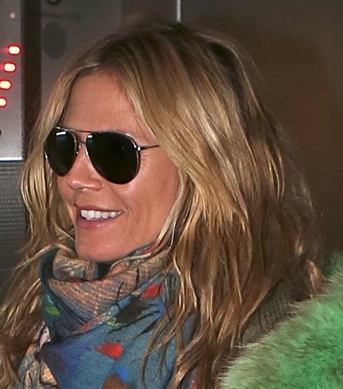 Heidi Klum styled her multicolored scarf with sunglasses and messy-looking hair