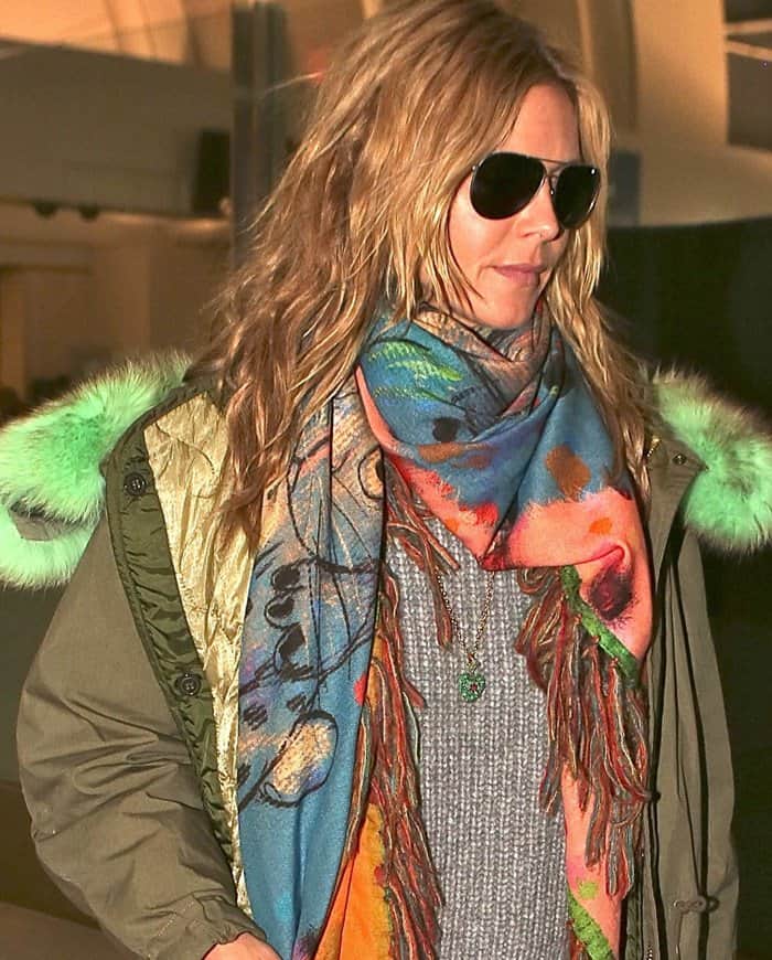 Heidi Klum wears a colorful orange, blue, pink, and green scarf