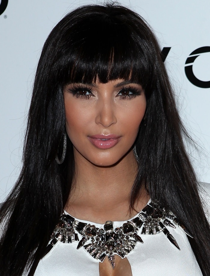 Kim Kardashian in a white Gucci dress with an embellished neckline