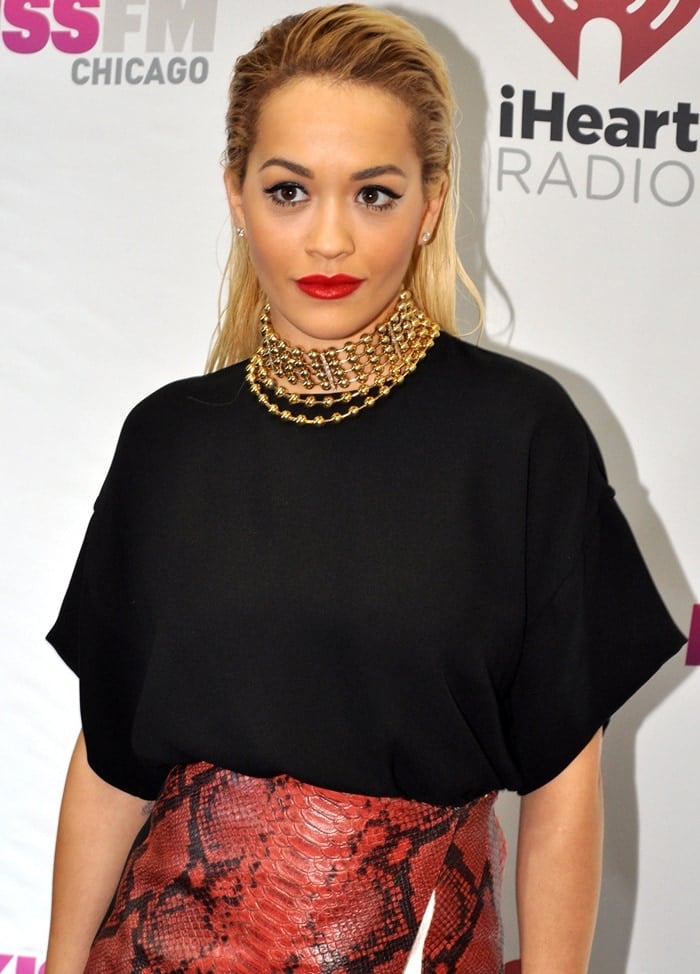 Rita Ora's signature red lip and slicked-back hair only added to the chic effect