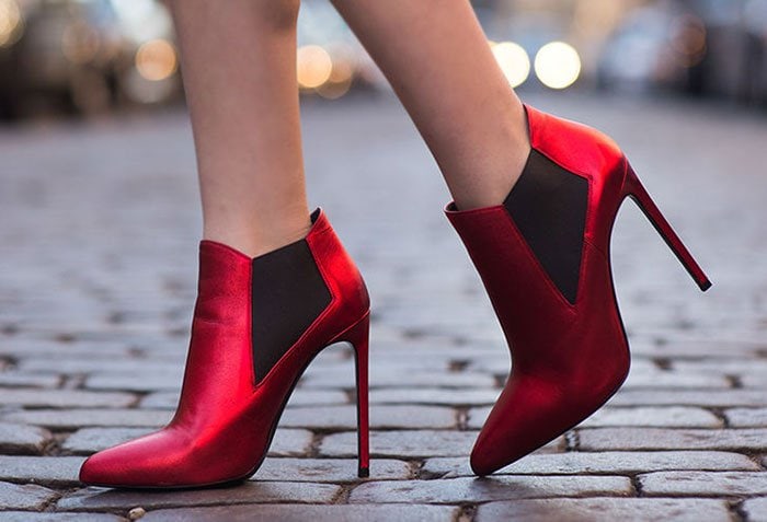 Alexandra flaunts her legs in metallic red booties