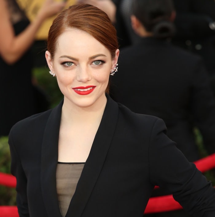 Emma Stone's tuxedo gown featuring sheer black paneling