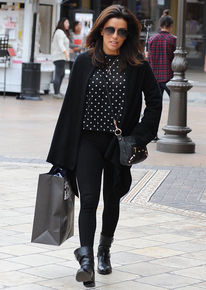 Eva Longoria shows how to wear black leggings with matching biker boots