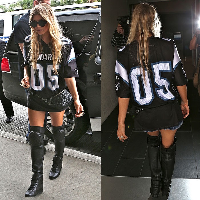 Fergie wearing tall sneaker boots