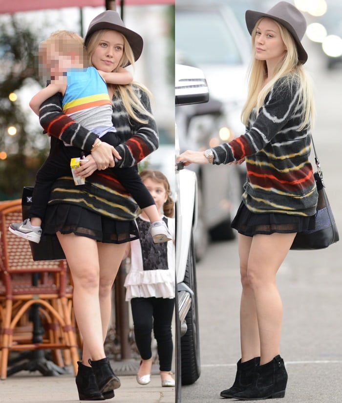 Makeup free Hilary Duff wearing a felt hat and a short black skirt takes son Luca Comrie to Pint Size Kids in Los Angeles on January 28, 2015