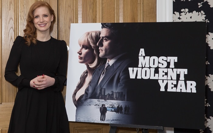 Jessica Chastain in a black dress from Saint Laurent featuring a nipped in waist