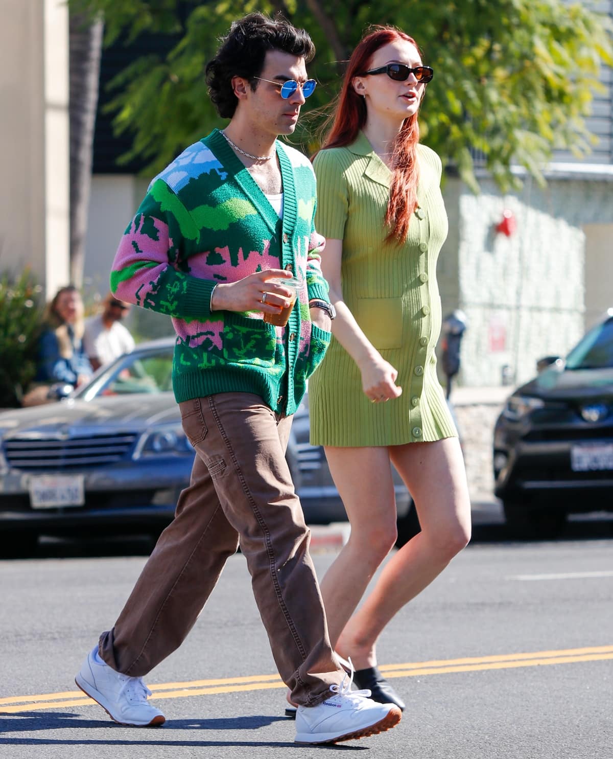 Sophie Turner styled her apple green dress with Vagabond Katlin mules and Thierry Lasry Victimy sunglasses