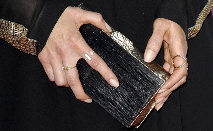 Bellamy Young toted a clutch by Kara Ross and accessorized with jewelry by Eva Fehren and Jennifer Fisher