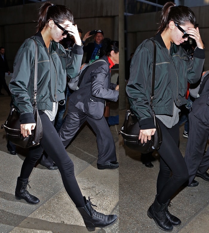 Kendall Jenner rocks black lace-up quilted leather combat boots from Chanel