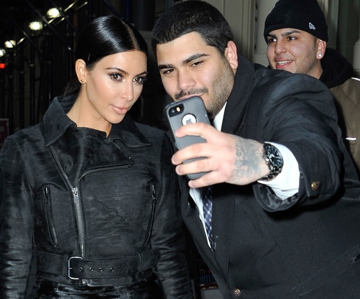 Kim Kardashian takes a photo with a fan in New York on January 8, 2015