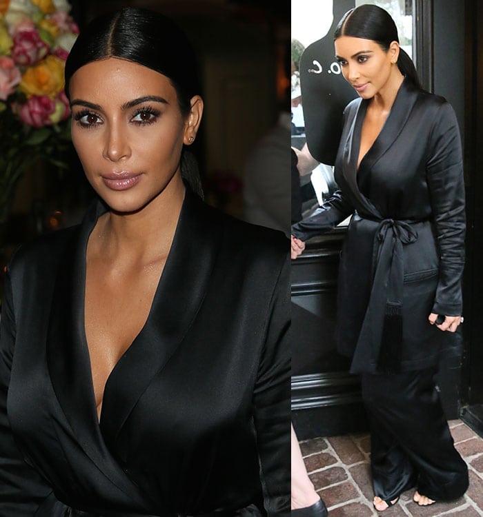 Kim Kardashian exudes elegance in a sleek black satin wrap dress paired with matching wide-leg trousers at the W magazine’s It Girls Celebration