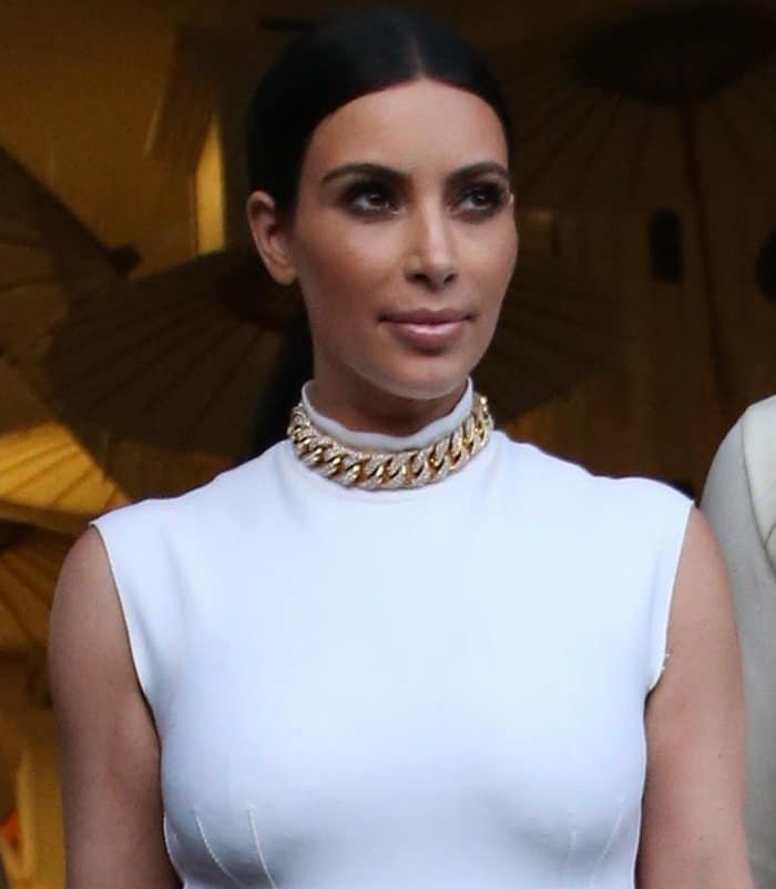 Kim Kardashian stuns in a sleek white Lanvin top paired with a statement gold chain necklace