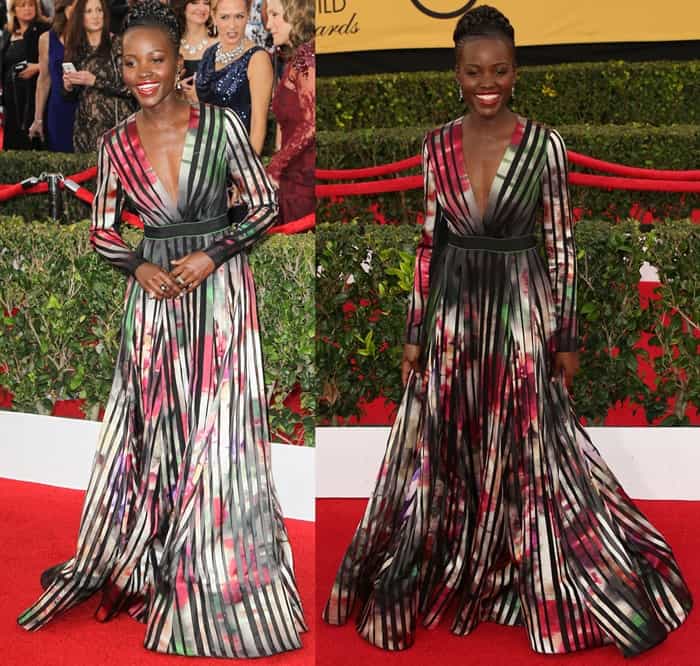 Lupita Nyong’o captivates on the red carpet in a long-sleeve, multicolored Elie Saab gown with abstract floral motifs and bold black striping, complete with a black belt, at the 2015 SAG Awards