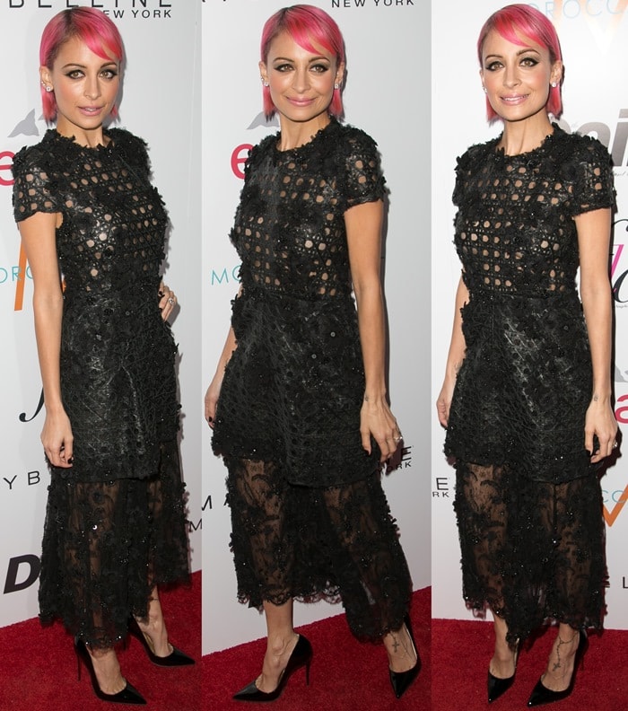 Nicole Richie flaunts her short pink hair and a black textured dress from the Alfredo Villalba Fall 2014 collection, paired with classic Christian Louboutin "So Kate" pumps