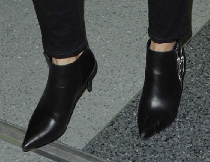 Reese Witherspoon's ankle boots feature double silver-tone zippers