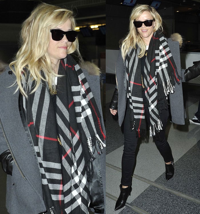 Reese Witherspoon wears a fur-trimmed gray coat with a scarf