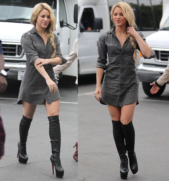 Shakira rocks boots with a denim mini dress