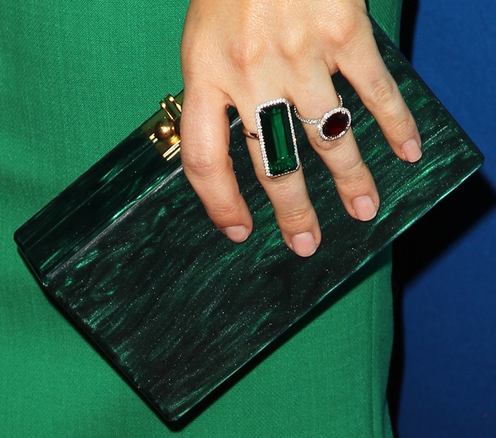 Sophia Bush totes an emerald-green Edie Parker Jean clutch