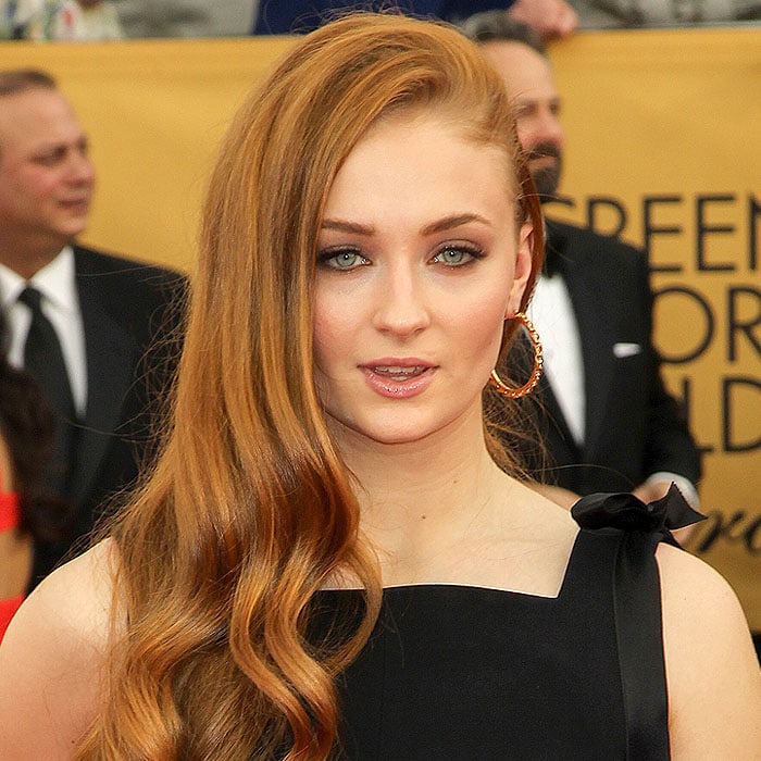 Sophie Turner wearing Vicki Sarge gold hoop earrings