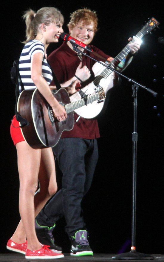 Taylor Swift brings out her guitar to perform with musician Ed Sheeran