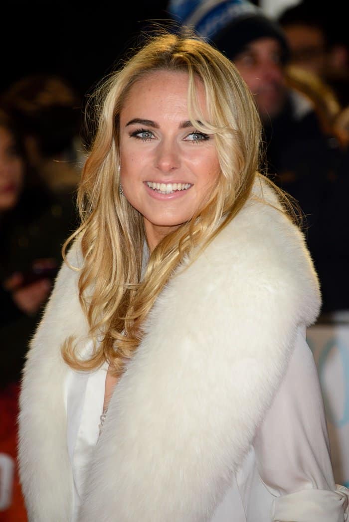 Kimberley Garner wears a white fur scarf at the screening of Mortdecai