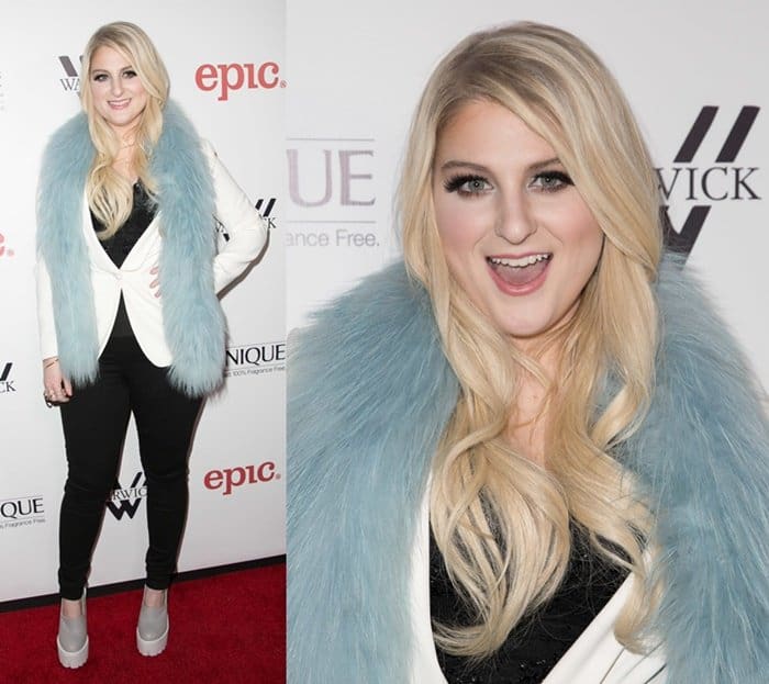 Meghan Trainor was stunning in a light blue scarf paired with a black and white ensemble consisting of a top, trousers, and a white blazer, but her shoes did not complement the outfit