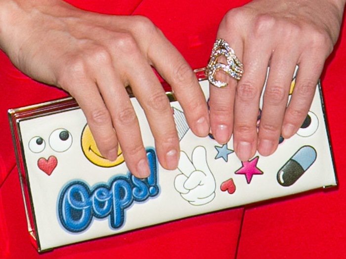 Diane Kruger carries a whimsical Anya Hindmarch clutch on the red carpet