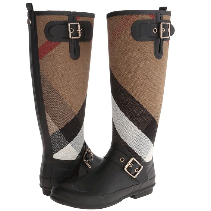 Exploded checks lend signature élan to a stylish rain boot detailed with shining square buckles