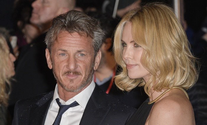 The height difference between Charlize Theron and Sean Penn is approximately 1.75 inches or about 4.445 centimeters