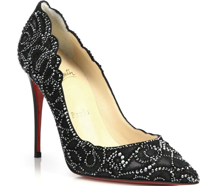 This black pointy-toe pump uses hand-placed crystals to illuminate its elegant lines, meticulously crafted for an ornate lace-like effect