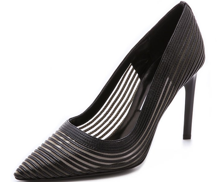 Sheer mesh peeks through strips of leather on these DVF pumps