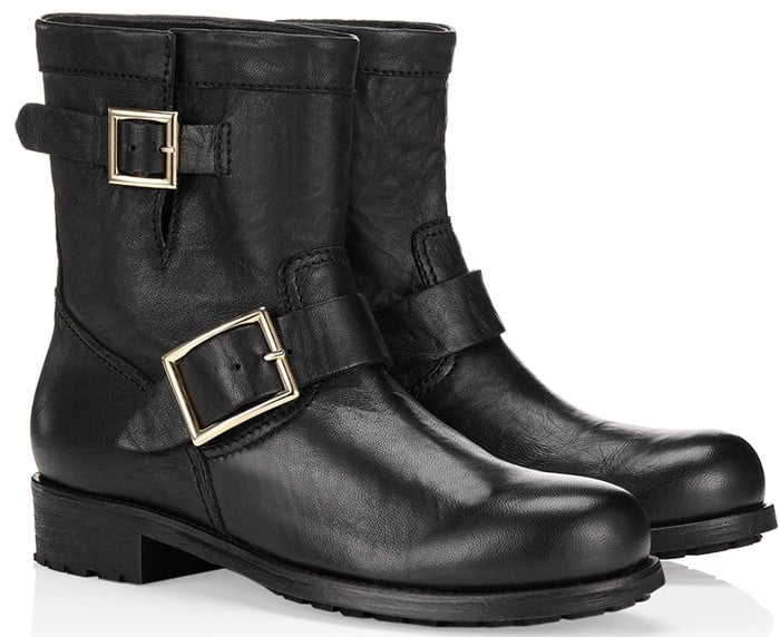 Two gleaming buckles detail a stacked-heel boot inspired by classic motorcycle style