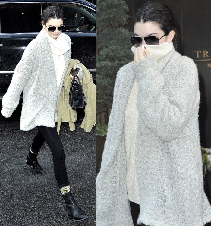 Kendall Jenner in a cream high-neck sweater top and fitted pants