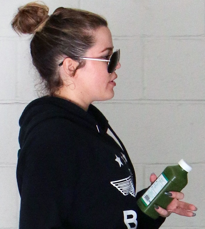 Khloe Kardashian wears a black Boy London "Star Eagle" hoodie