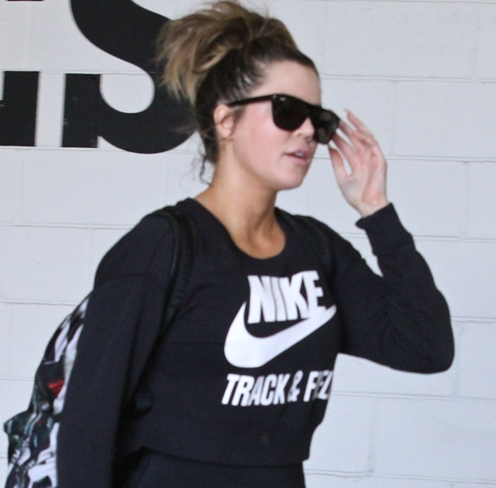 Khloe Kardashian's black crop-top crew neck sweatshirt by Nike