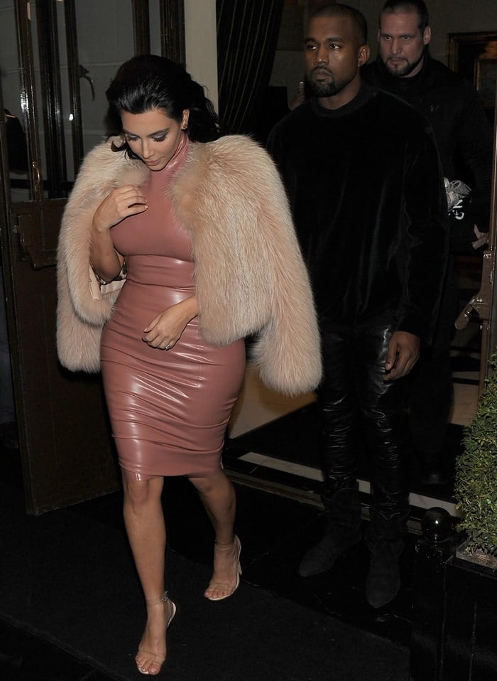 Kim Kardashian styled the latex dress with a large beige fur coat