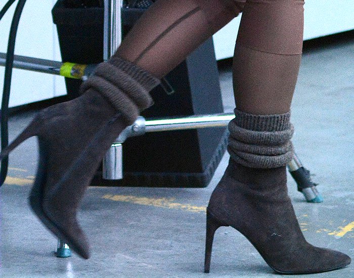 Scrunched-down socks and brown suede booties with Kim Kardashian's head-to-toe Yeezy look