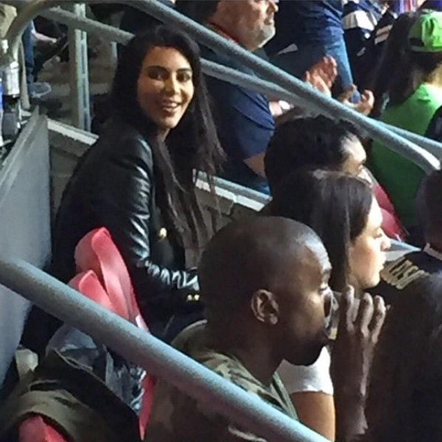 Kim Kardashian and Kanye West appear in a photo taken by a fan