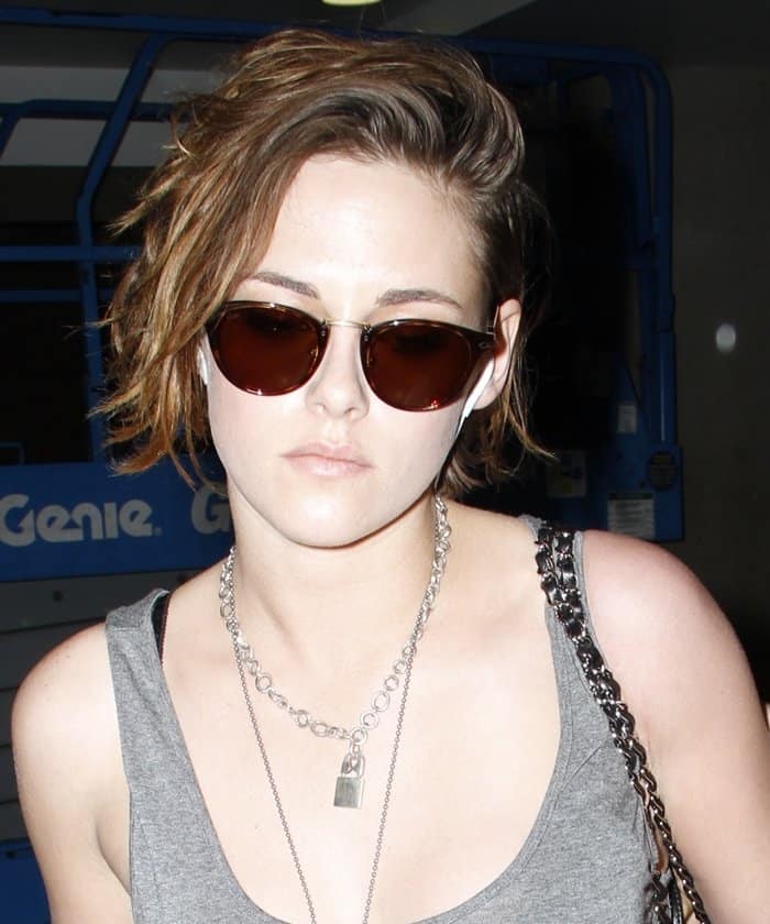 Kristen Stewart's silver chain necklace with a small padlock pendant