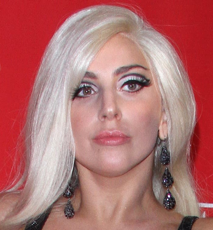 Lady Gaga dazzles with dramatic makeup and glamorous earrings at the MusiCares 2015 Person Of The Year Gala