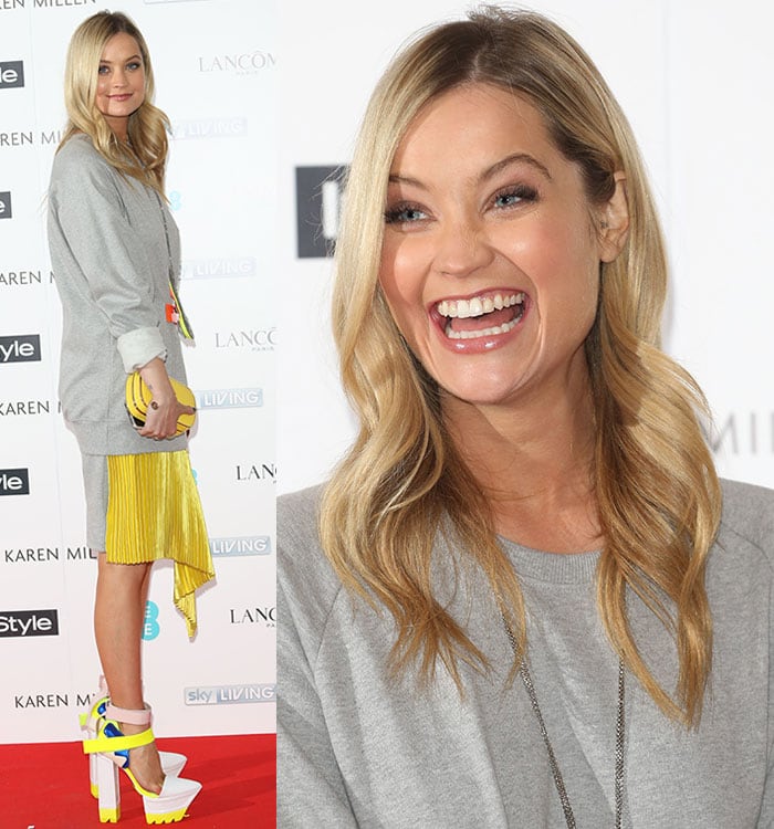 Laura Whitmore flashes a bright, radiant smile, showing off her perfectly styled blonde waves, flawless makeup, and sparkling white teeth