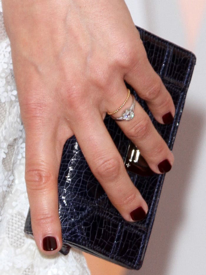 Marion Cotillard shows off her rings and clutch bag on the red carpet