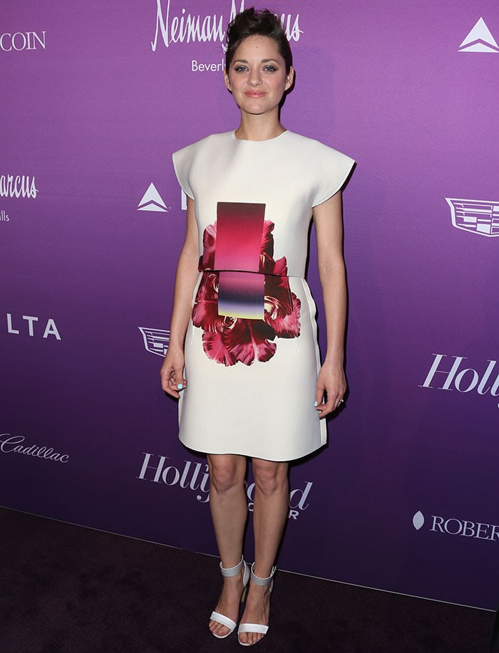 Marion Cotillard flaunted her legs in a cream-colored, abstract-printed two-piece outfit by Carolina Herrera