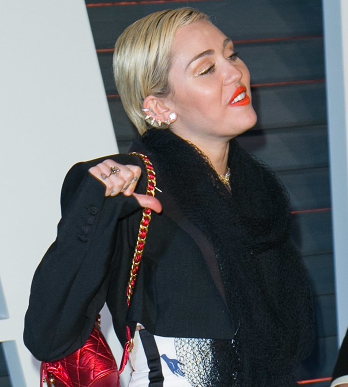 Miley Cyrus wearing a tulle scarf from the Schiaparelli Couture Spring 2015 collection
